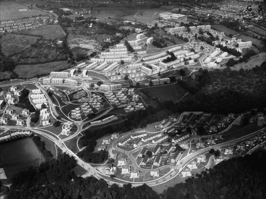 Figure 4:  Newfield Green (Gleadless Valley) in the late 1960s.  This estate was built across very steeply sloping fields incorporated former field boundaries and mature woodlands. The dwelling types where chosen for their suitability to individual topographic locations. © Aerofilms / English Heritage National Monuments Record.