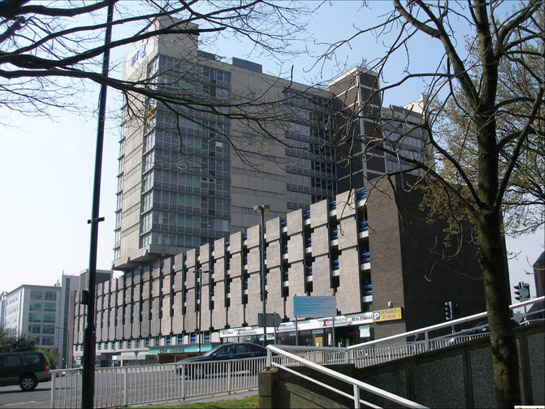 Text Box: Figure 1: Telephone House, built in 1972 above a brutalist inspired car park is typical of the architecture originally built around the 20th century urban dual carriageways of this zone.