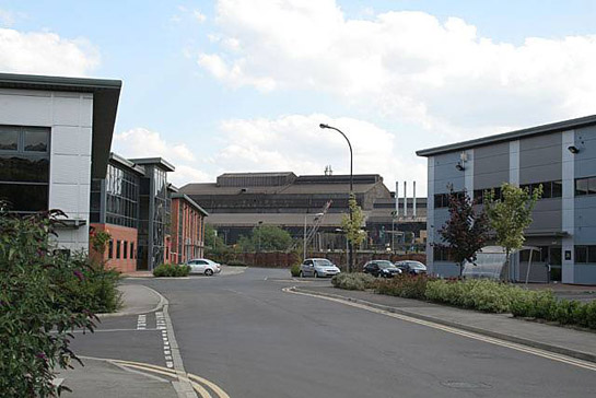 Text Box: Figure 1: ‘New and Old in Brightside’ – In the foreground are office buildings of ‘Jessop’s Riverside’ an early 21st Century commercial development of a former steelworks site.  In this zone such developments typically sit alongside surviving industrial complexes.  In the background are the Electric Arc Melting sheds of Sheffield Forgemasters